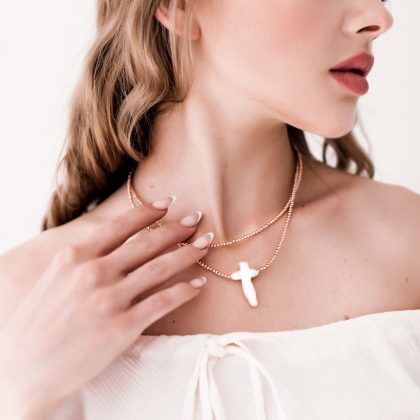Quiet elegance” – White Baroque pearl cross pendant, rose gold